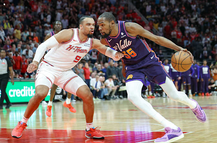 Suns forward Kevin Durant (35) drives to the basket as Houston Rockets forward Dillon Brooks (9) defends during the fourth quarter at Toyota Center.